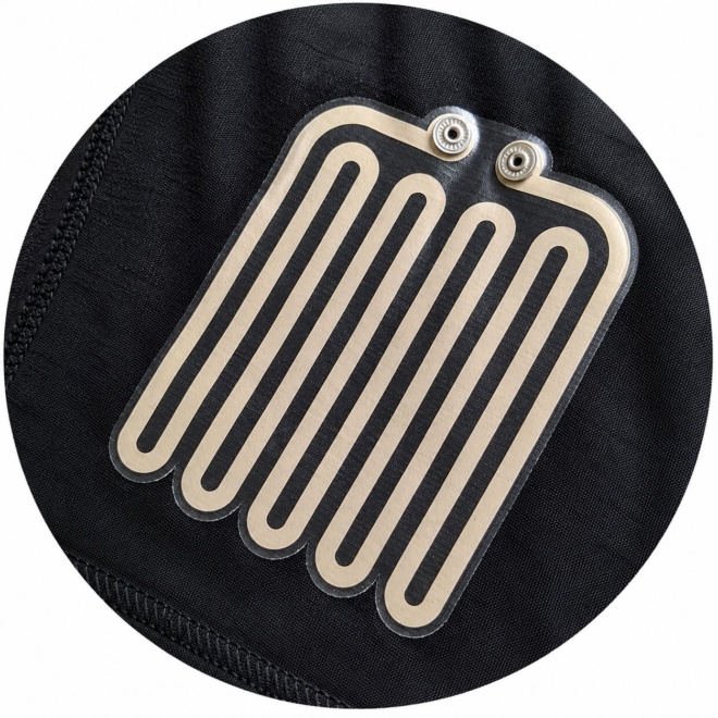 Flexible printed heating element integrated into textile for smart clothing and wearable applications